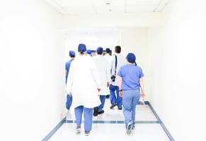 nurses walking down a hallway