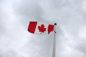Canada flag agaist cloudy sky